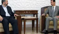 الرئيس السوري بشار الأسد وخالد مشعل رئيس حركة حماس في الخارج