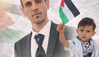 الشهيد علي بني عودة وطفله