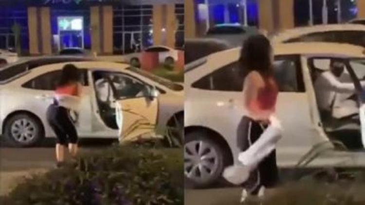 فتاة ترقص في أحد شوارع الرياض