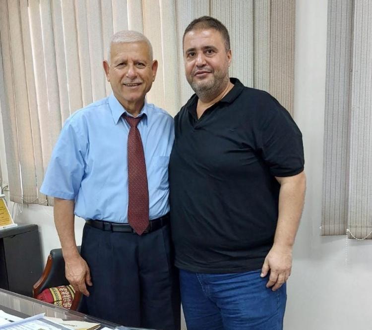 صالح ساق الله مع رئيس جامعة غزة حسن أبو جراد